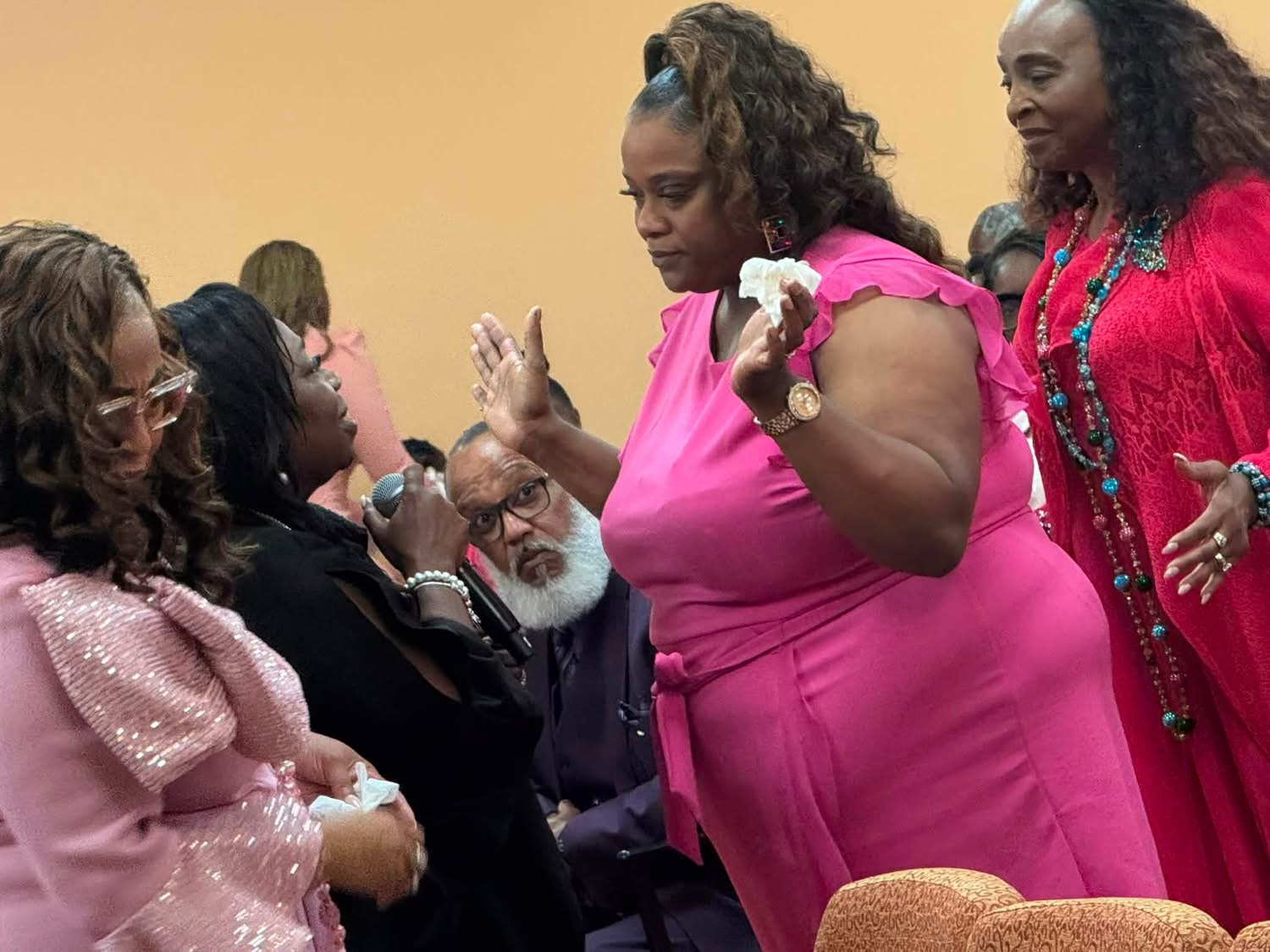 Prayer team encouraging a worshipper